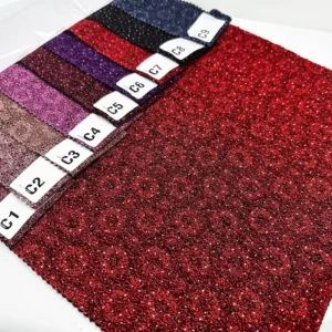 Embossed Knitted Metallic Fabric with Glued Glitters for Fashion Garment
